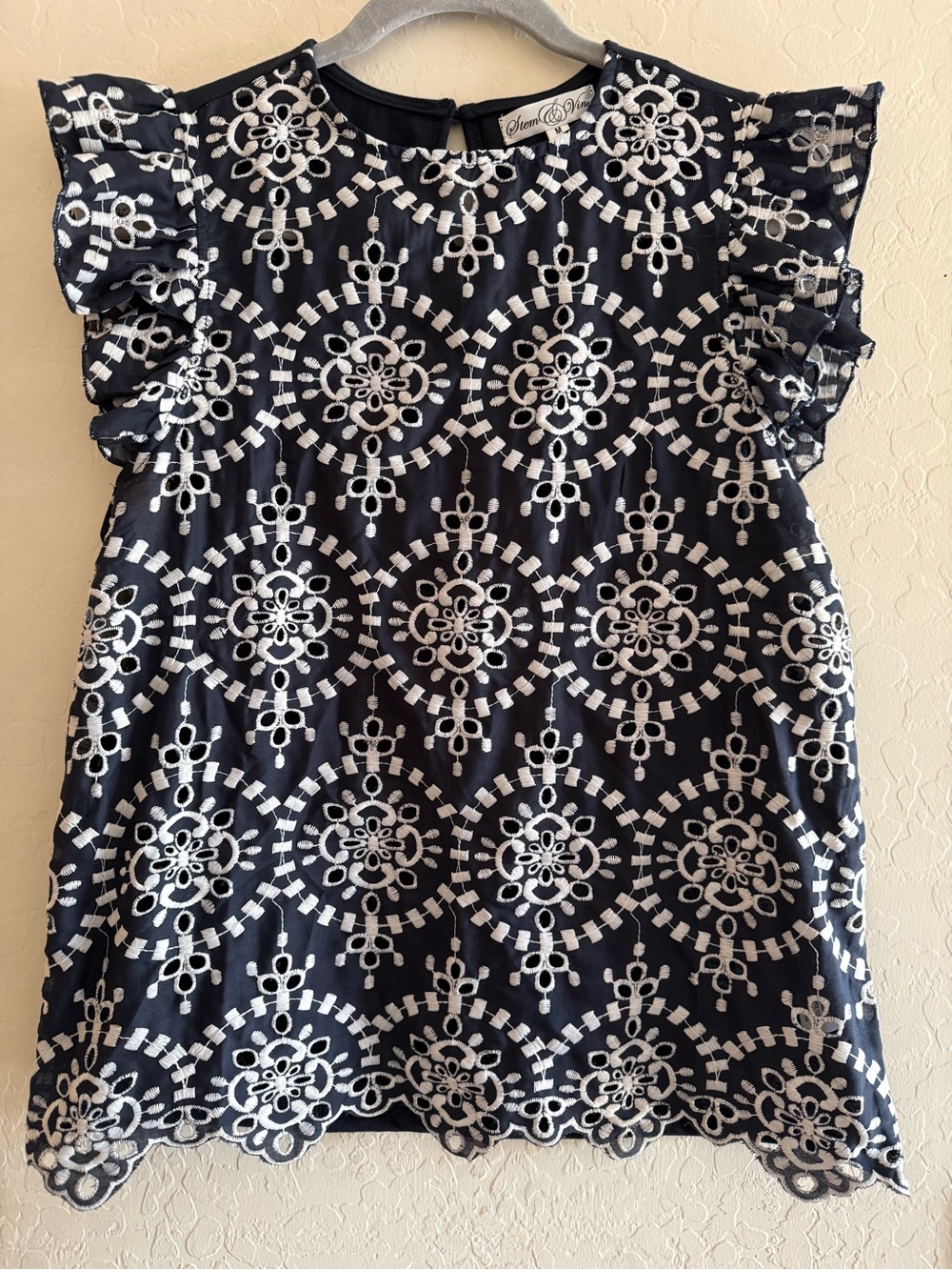 Stem & Vine, medium, navy blue top with white geometric eyelet embroidery
